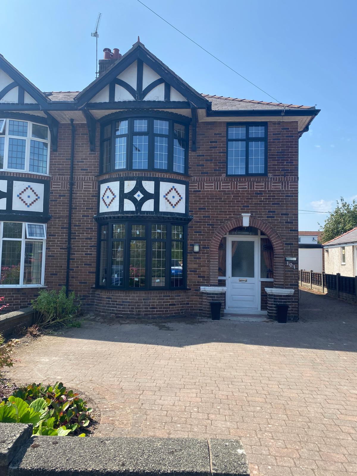 Reynaers Heritage Windows in Buckley using SL68 slimline aluminium frames in RAL 9005 with 28mm Low-E leaded units.